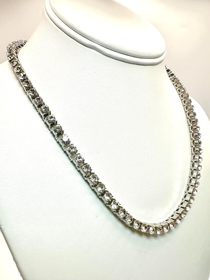 Sparkling 14 Kt White Gold Plated 37.5 Cttw Simulated Diamond Tennis Necklace: Sparkling 14 Kt White Gold Plated 37.5 Ctw Lab Simulated Diamond Tennis Necklace. These 79 Individual Lab Simulated Diamonds are Eye-Clean and White in color. They are Brilliant Round Cuts Measuring 4