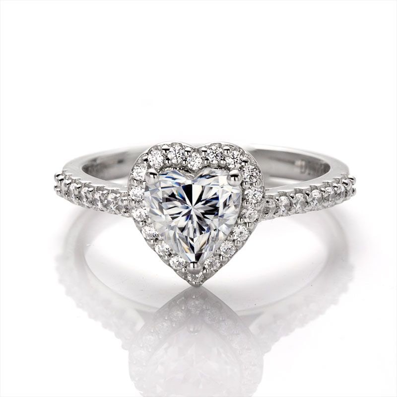 Sparkling 1 Ct VVS1 White F-G Fire Moissanite Ring: This Lovely 1 CT Heart Cut Moissanite Centerstone is a VVS1 Brilliant 6.5 mm. The Color is White G-H. It is near flawless and bursting out with a full spectrum of colors. This Moissanite Ring is compl