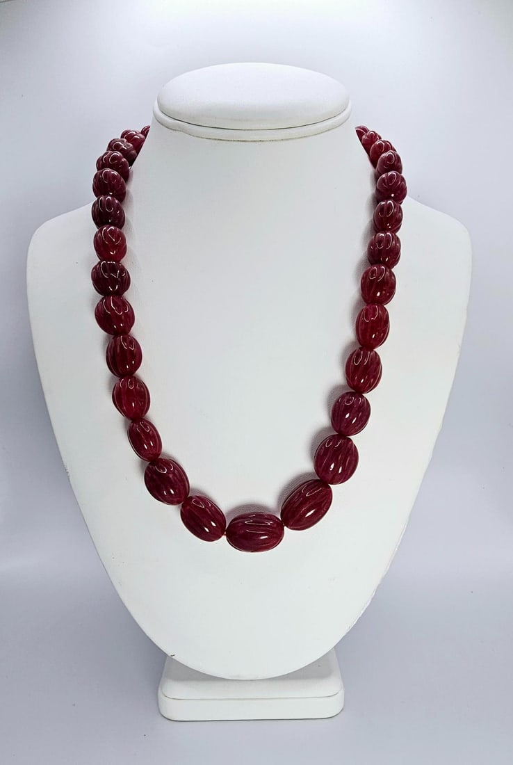 Beautiful Large 532 Ctw Mined From The Earth Natural Ruby Necklace: Stunning Large 566.50 Ctw Mined From The Earth Natural Red Ruby Necklace. This necklace is made with large carved oval pear cut beads that range in size from approx 12 to 18 mm. This necklace is also 