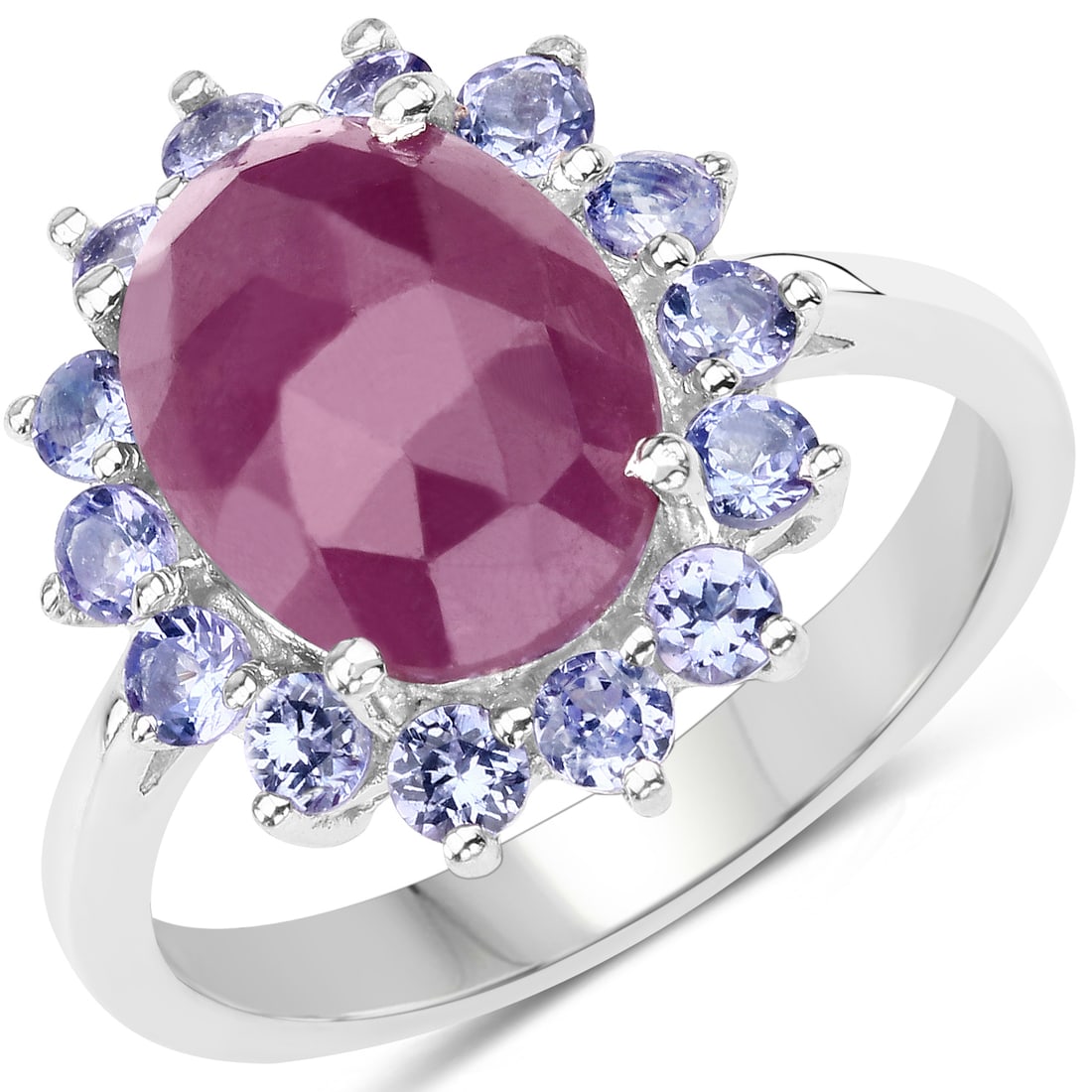 Plated Rhodium 5.53ctw Pink Sapphire and Tanzanite Ring: A natural 12x9mm oval pink sapphire (4.55ctw) anchors this rhodium plated .925 sterling silver cocktail ring, surrounded by fourteen round natural tanzanites (2.40mm, 0.98ctw) for a vivid pink and vio