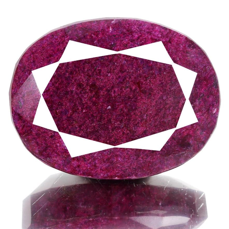 Huge Museum Size 1230 Ct Certified Natural Oval Cut Red Ruby Solitaire: Huge Museum Size 1230 Ct Certified Natural Oval Cut Red Ruby Solitaire. This pigeon blood red ruby is a faceted oval cut measuring 71 x 54 x 31 mm. Has a beautiful even dark? burgundy red even hue