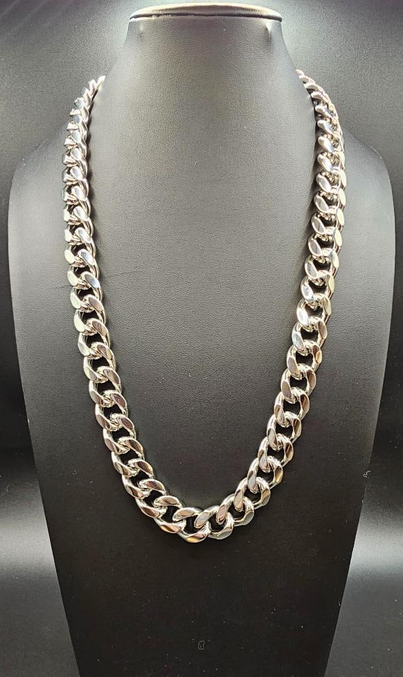 Huge 229.2 14 Kt White Gold Plate Cuban Link Necklace: Huge 229.2 Gram14 Kt Tri-Layered White Gold Plated Cuban Link Necklace. This necklace is 24 inches long and is a thick 14 mm wide? Secured with a Double Safety Clasp. This necklace weighs in at a Stea