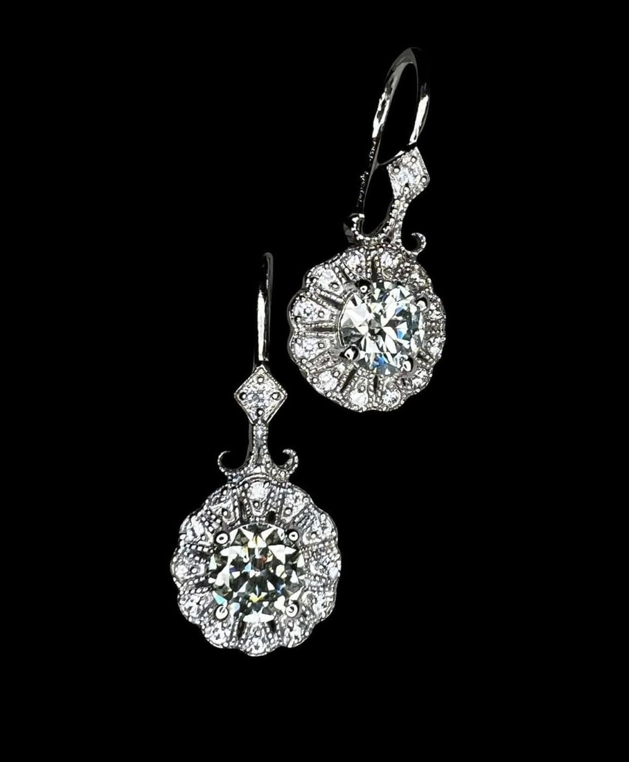 Stunning 4.25 Cwt. White Ice Blue Fire Moissanite Earrings: These 2 Fire Moissanite Center-Stones are Mounted in .925 solid sterling silver set in 14 Kt White Gold Plate, which gives these earrings their high polish and shine. They are also tarnish resistant. 