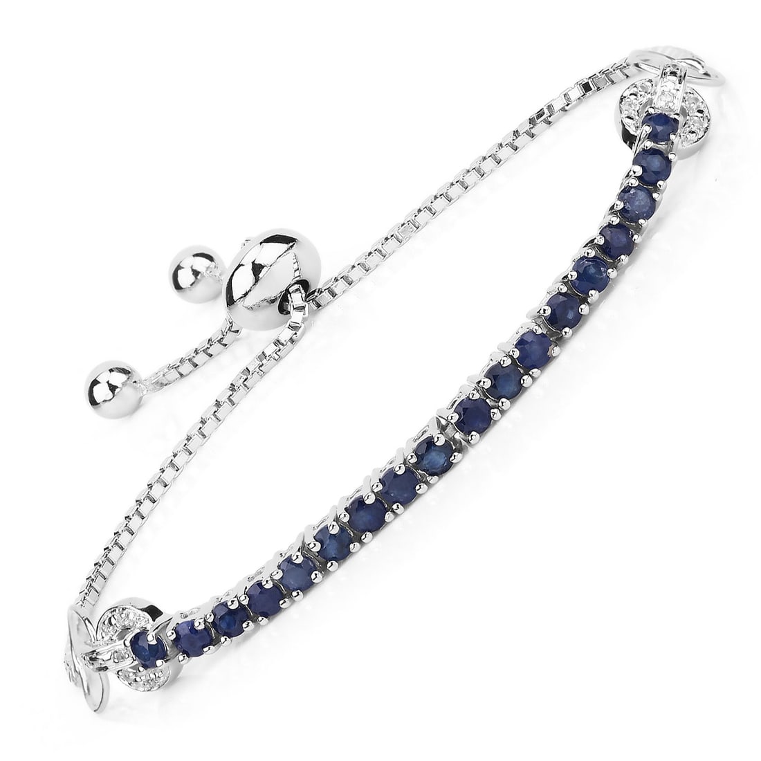 Plated Rhodium 2.41ctw Blue Sapphire and White Zircon Bracelet: This rhodium?plated .925 sterling silver bolo bracelet features 2.41 ctw of gemstones, led by eighteen 3.00 mm natural, heat?treated blue sapphires totaling 2.34 ctw. Twelve 1.00 mm white zircon accen