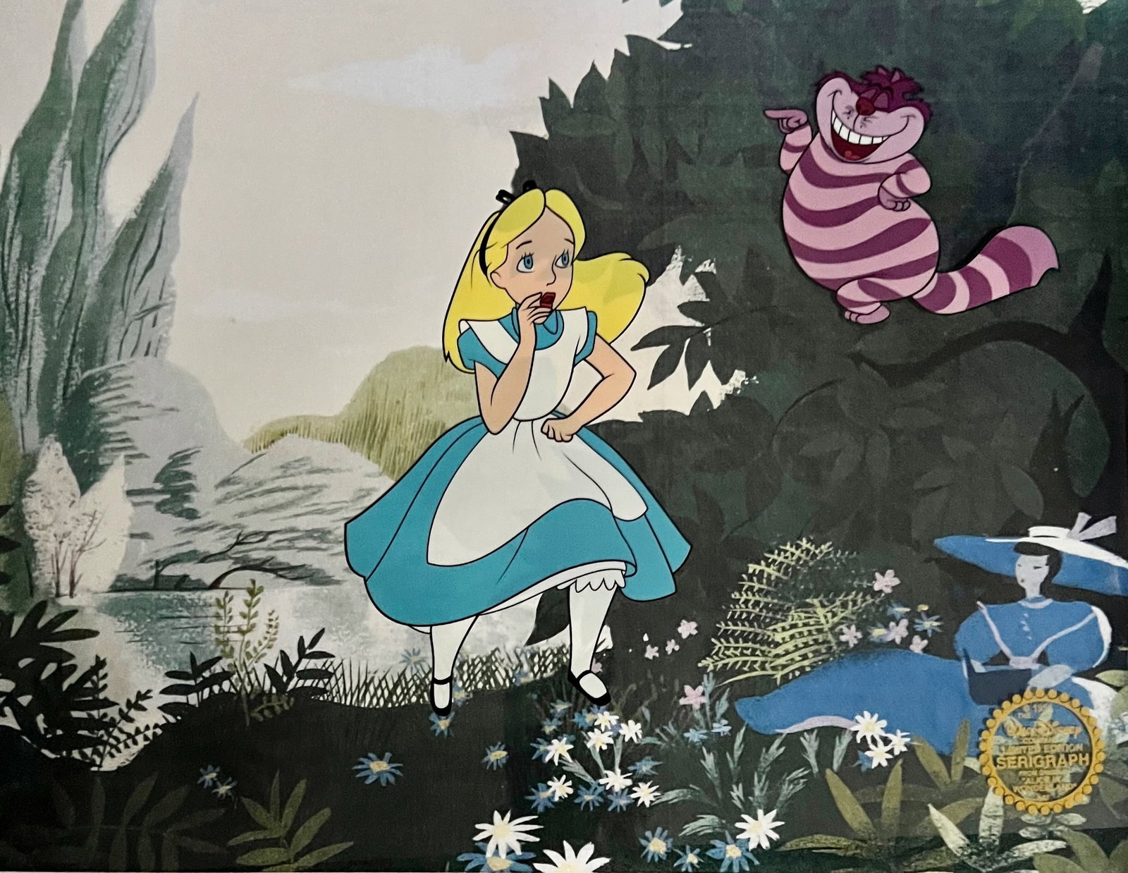 Disney ALICE IN WONDERLAND Cheshire Cat Sericel Animation Art Cel: This is a Limited Edition Serigraph Cel from 1951 Walt Disney Studios ? ALICE IN WONDERLAND. This sericel features the characters Alice and The Cheshire Cat. Disneys own artists have selected this sce