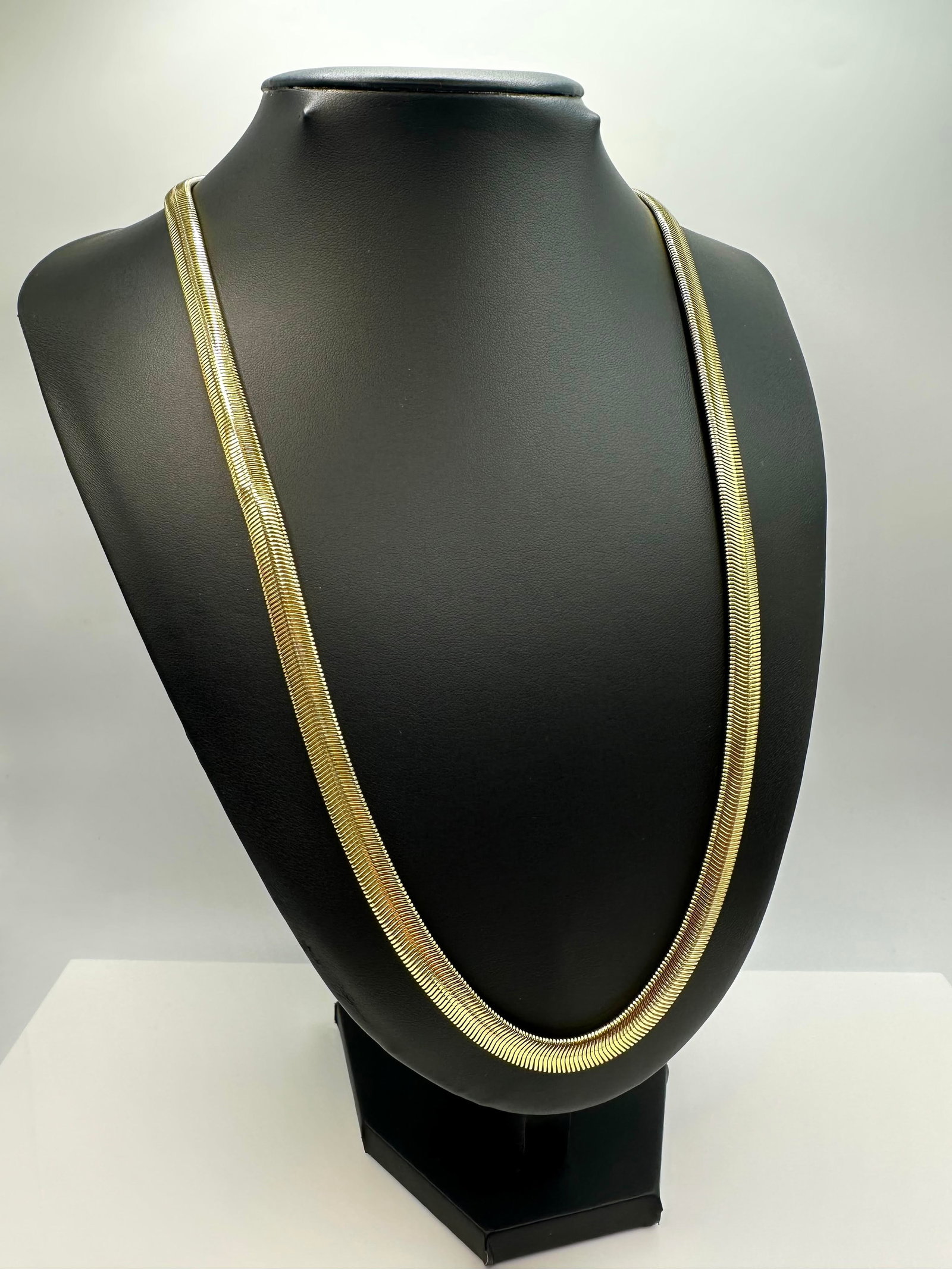 Sharp 37.6 Gram 14 Kt Tri-Layered .925 Sterling Silver Plate Herringbone Necklace: Sharp 37.6 Gram 14 Kt Yellow Gold Tri-Layered Snake Herribone Necklace, This 14 Kt Gold Plated snake Herringbone Necklace is 24 inches long and 8 mm. wide. The total gram Weight is approx.37.6 grams. 