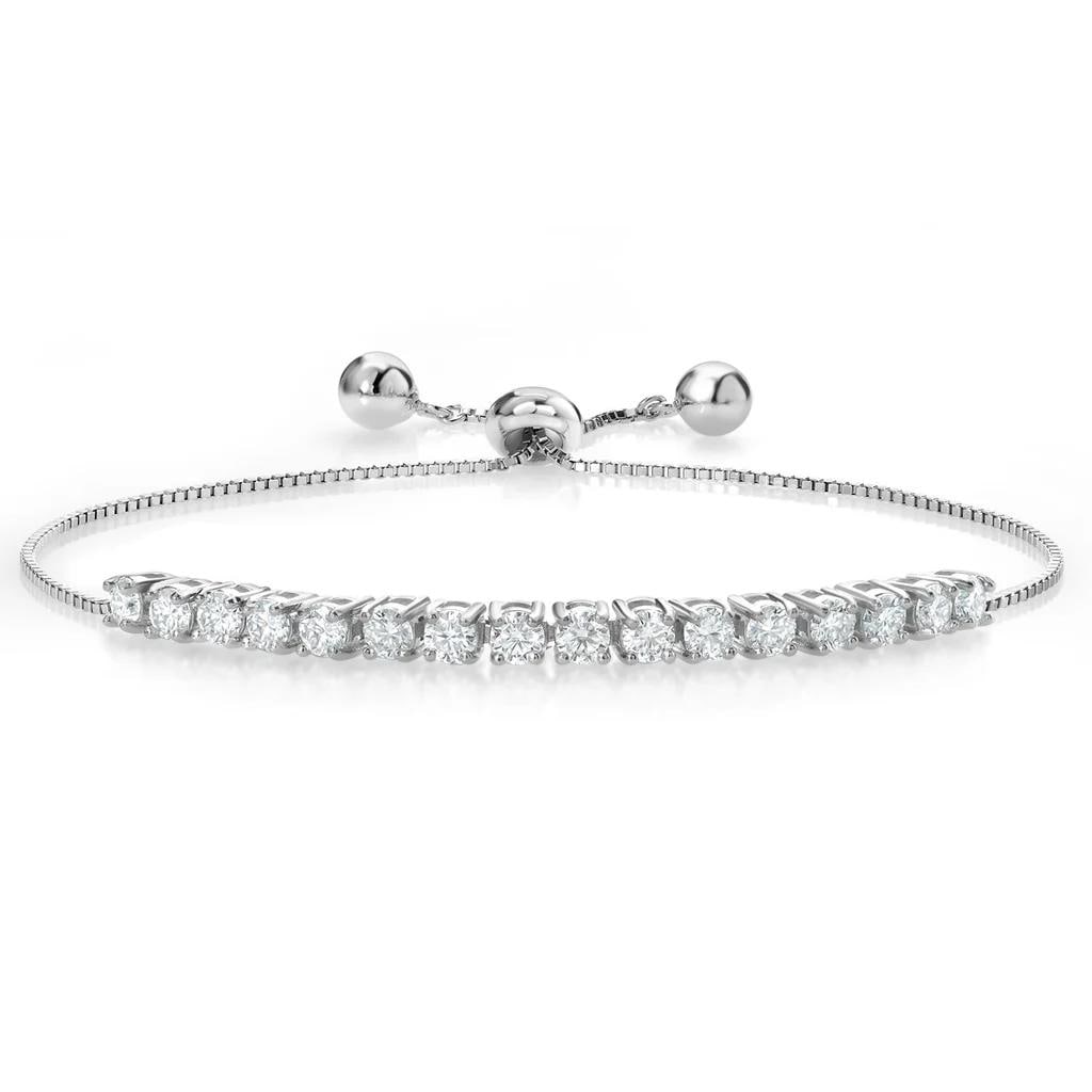 Plated Rhodium 1.60ctw Moissanite Bracelet: 16 Moissanite round stones with a total weight of 1.6cts. Each stone is 0.10cts with a near flawless color measuring 3x3mm. Fully adjustable up to 9 inches.