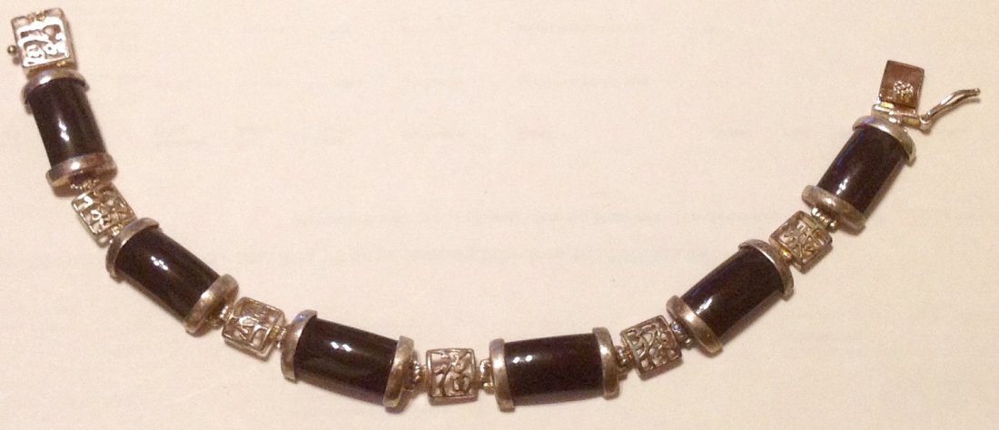 Estate vintage Sterling onyx sectional link bracelet: Estate items. Marked DBJ 925. Tested. Oriental motif. 16 grams. 8"