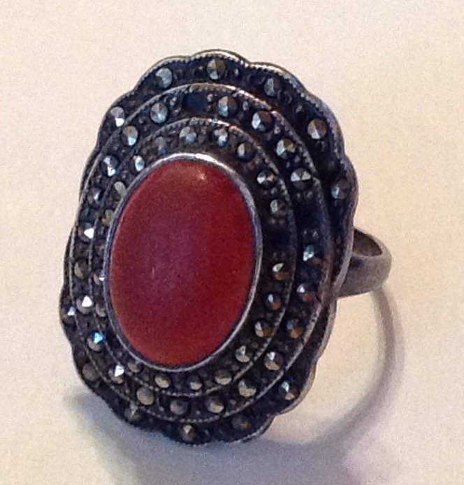 estate old sterling carnelian cocktail ring: Estate items. Marked. sterling . Tested . Silver , size. 6 . . 6.8 grams. Imperfections Some missing Marcasite and scuffs.