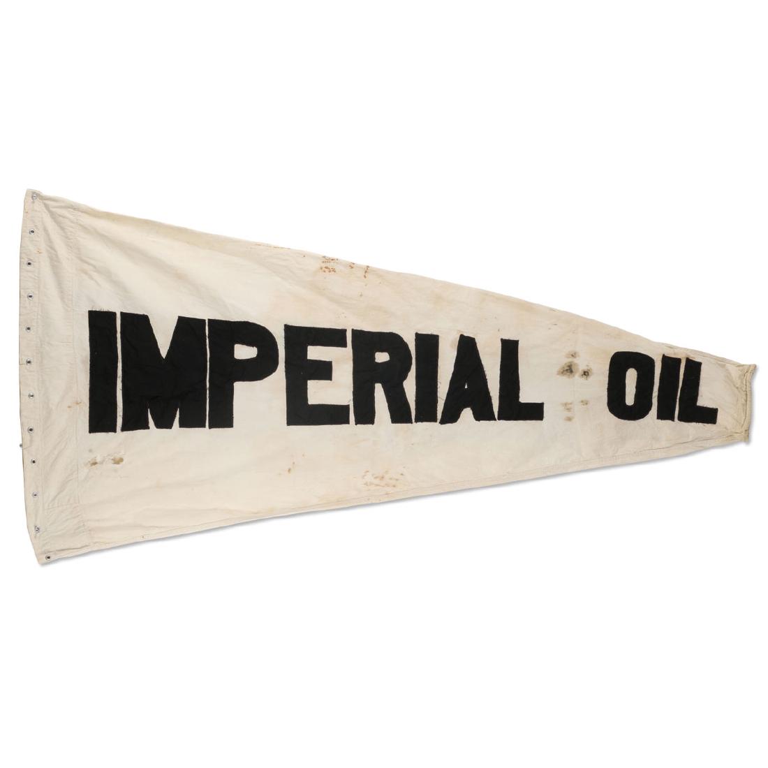 Early 1920’s Hand-Stitched Imperial Oil “Wind Sack”: 2-sided 1920’s cloth flag featuring hand-stitched letters and aluminum grommets. Minor soiling and a few scattered holes. Measures 67” in length. Width tapers from 32” to 7”.