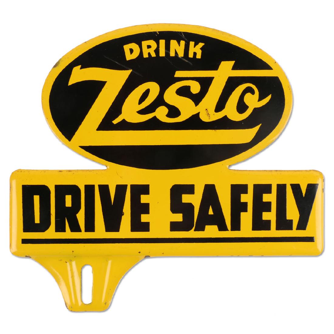 Zesto “Drive Safely” Lithographed Metal Plate Topper: Die-Cut plate topper promoting “Zesto” soda with the caption “Drive Safely”. Excellent condition with a few very minor surface blemishes. Measures 6.25” x 5.75”.
