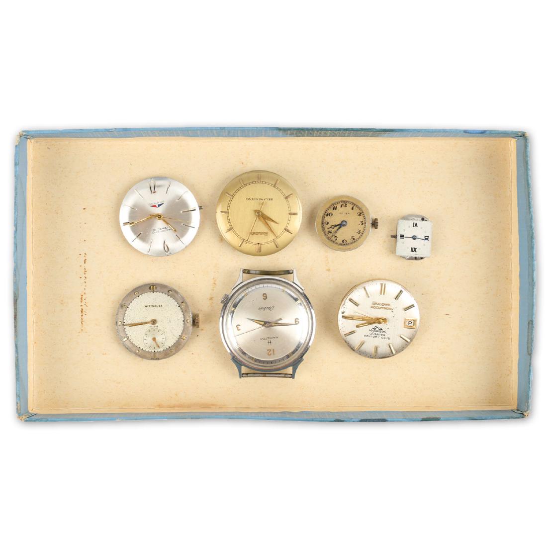 Seven (7) Wristwatch Movements Including Hamilton,: Lot includes 7 loose movements with dials and most include hands. Includes an “Eaton’s 1/4 Century Club Bulova Accutron”. Also includes a seemingly complete Hamilton “Electric”. All untested