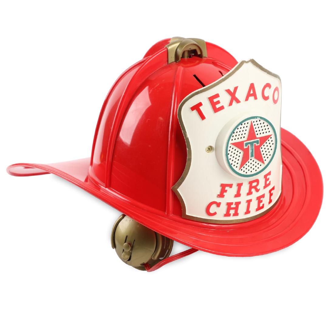 Texaco Fire Chief Siren Helmet: 15” x 11” x 6”. Texaco Fire Chief Siren Helmet 1960s. Thick plastic helmet containing battery-operated siren speaker hidden in badge. Functions properly with fresh batteries. A small split to th