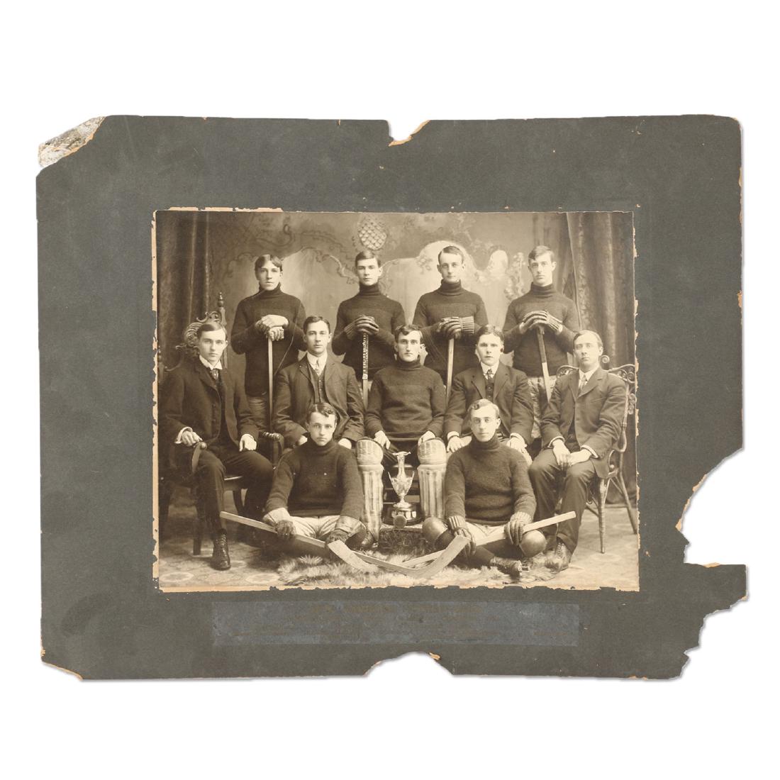 Photographs, New Hamburg Hockey Club, Band: Two (2). 1908 Oxford-Waterloo Champions, with trophy. New Hamburg Band. Luckhardt estate. Condition: Open tears to matting. 16" x 20".