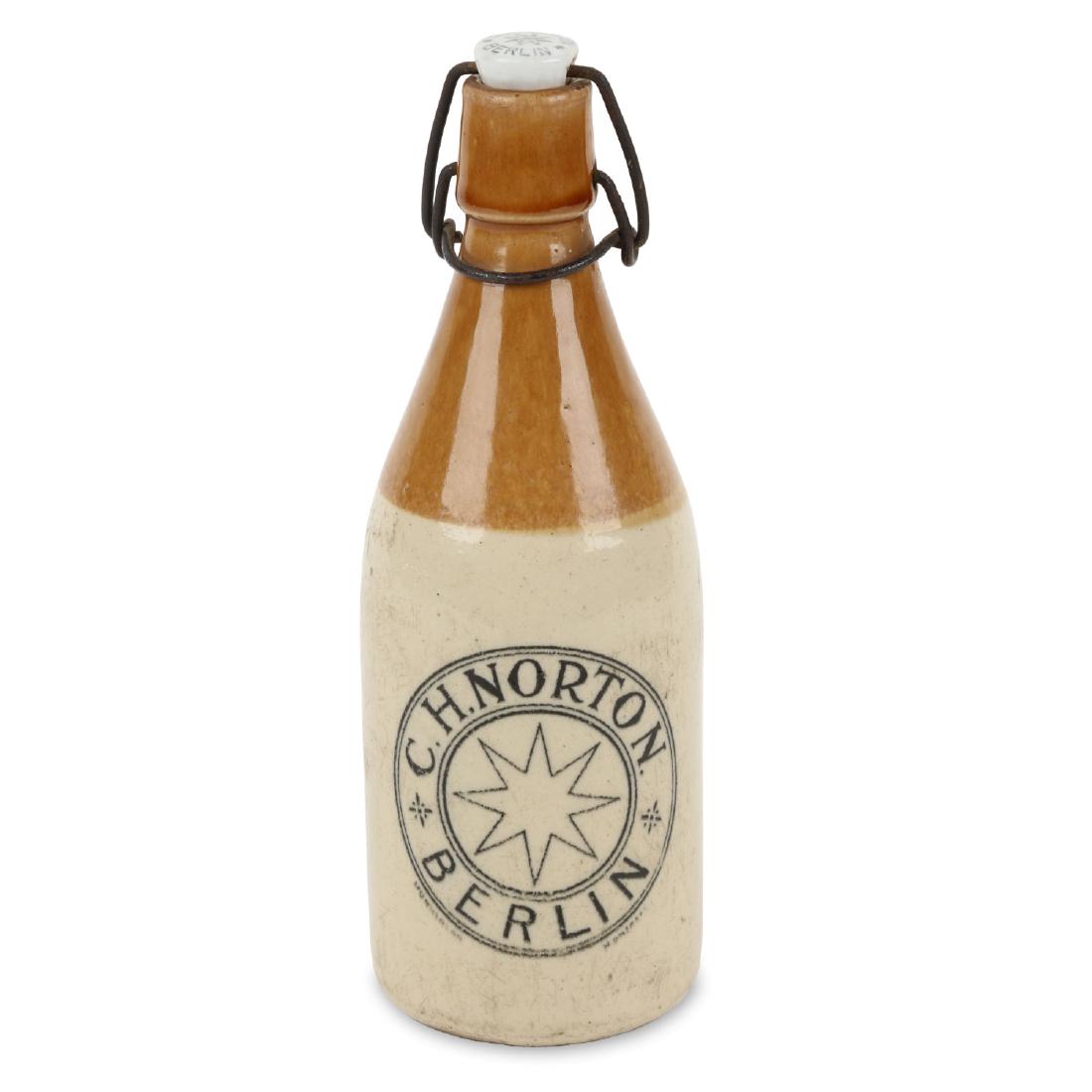 C.H. Norton Ginger Beer Bottle, Berlin: Ontario two-tone glaze, original closure with named porcelain stopper. Condition: Very Good. Slight glaze wear. 9" h