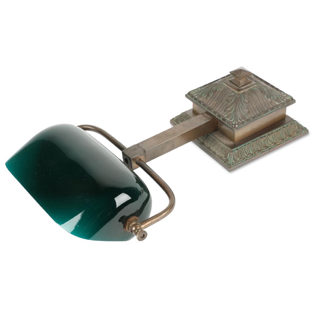 Emeralite Roll-Top Desk Lamp: Green/white cased-glass shade mounted to weighted brass base. c. 1920. Shade marked "Emeralite". Pull chain with acorn end. This particular base was used atop roll top desks and certain types of piano