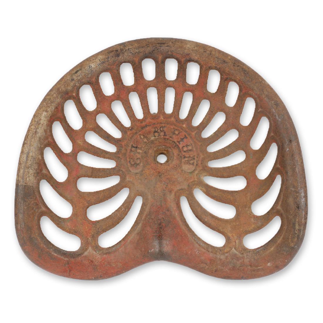 "Champion" Cast Tractor Seat: Cast Iron. Condition: Good. No cracks. Untouched original with related cog. 19" x 4 .25" x 16".