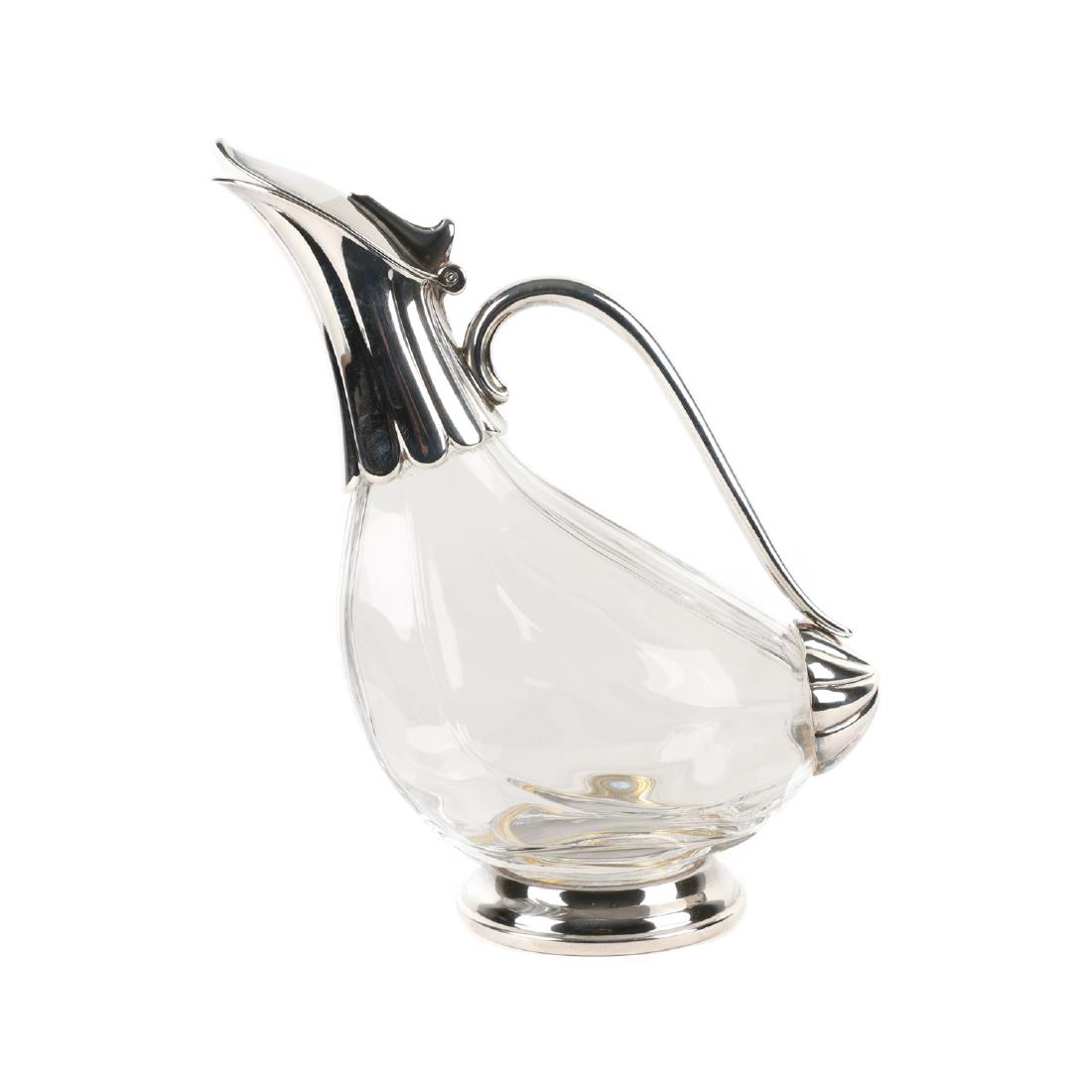 Figural Silver Crystal Wine Carafe: Lot 97 - Probably Danish. Silverplated fittings with ribbed "goose" crystal body. 10" x 8". $200-300.