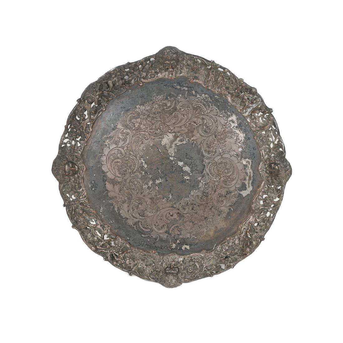 Large Round Silverplated Serving Tray: Lot 168 - Rising Sun mark, faces of Bacchus and female, woodland scenes and creatures, dolphin (Neptune) feet, on copper. Heavily tarnished. 25" dia. $200-300.