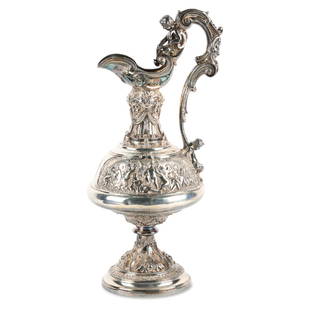 W. & G. Sissons Sterling Silver Wine Ewer: Lot 409 - Circa 1863. Sheffield, England. William & George Sissons. Repousse, chased and casting with young fauns and putti on the handle. Also in scenes around the main body dancing with goats and dr