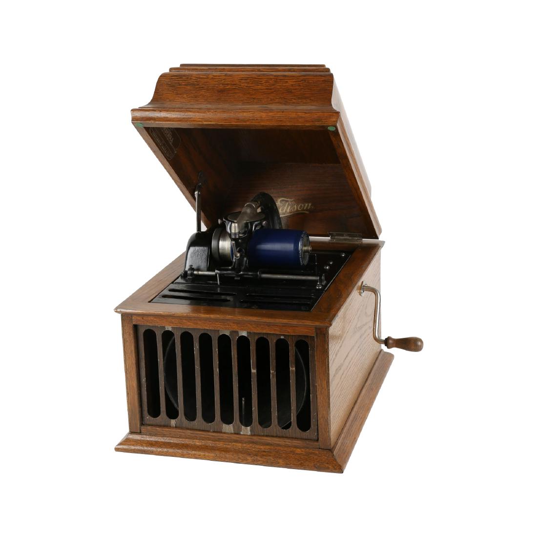 Edison Amberol 30 Phonograph: Amberol "30" table-top model. Quarter-sawn oak. Includes crank and speaker grille. 15" x 12.5" x 12". Top of case has been refinished. Fully functional. $300-400.