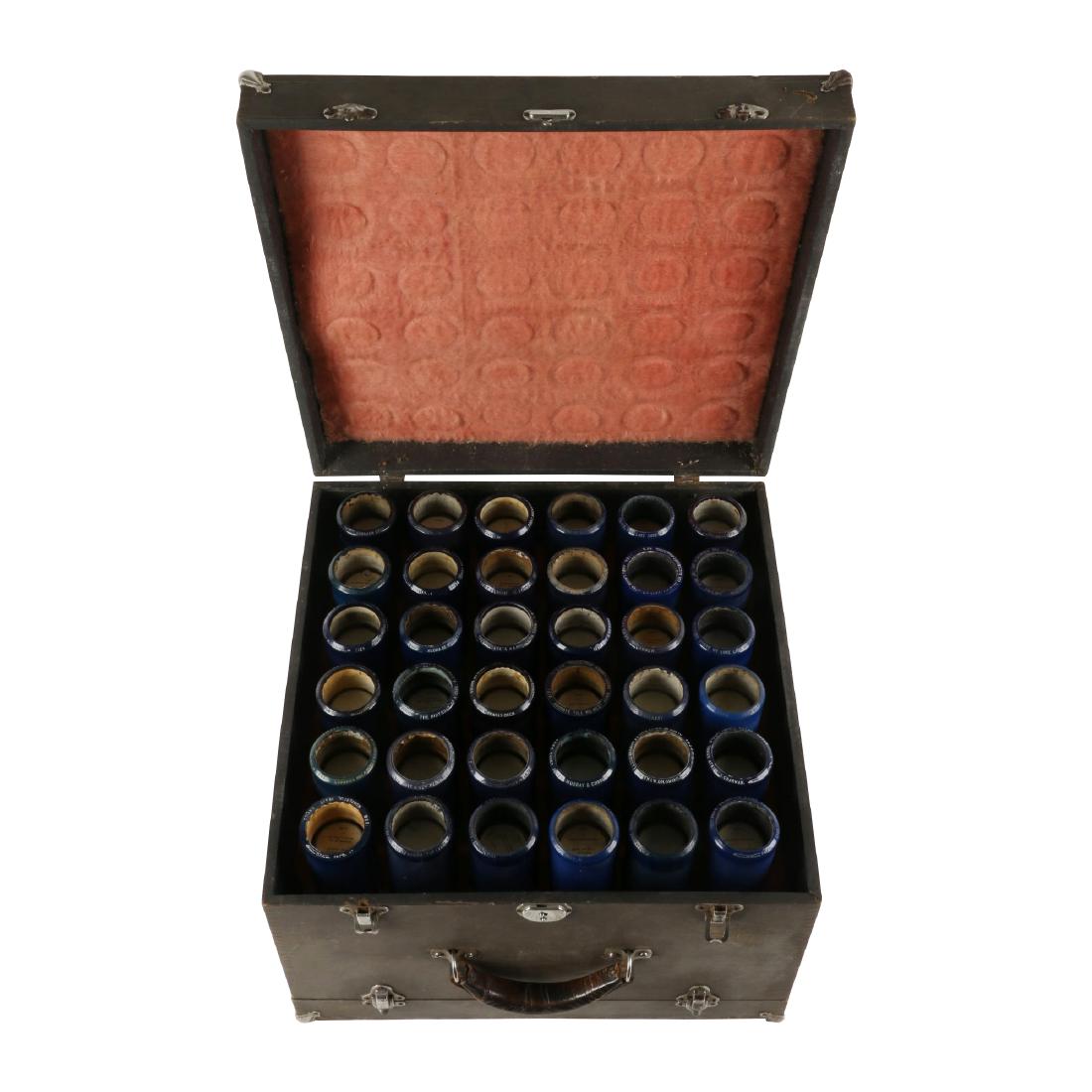 Cased Edison Blue Amberol Cylinders: 72 Edison blue Amberol 4 minute cylinder records in original carrying case. Each record labelled. Cylinders untested. Case measures 17" x 16" x 11". Stain and tears to cloth outer of case. $200-300.