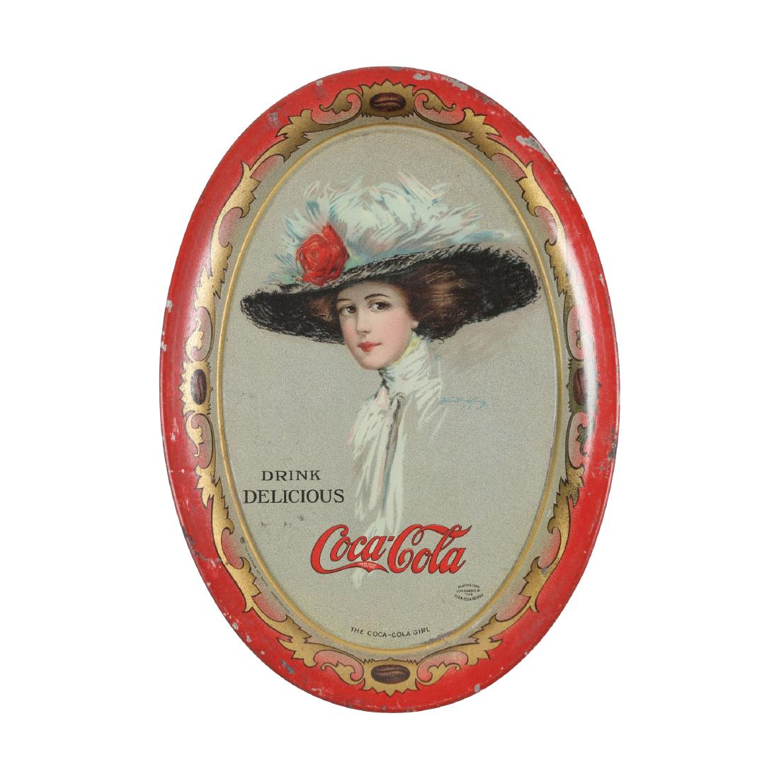 Coca-Cola Tin Litho Change Tray, 1910: American. Marked, "Painting Only, copyrighted by the Coca-Cola Co., 1909". Artwork by Hamilton King. 6" x 4.25". Scattered flakes to surface, mostly at edges. Minor impressions. $300-500.