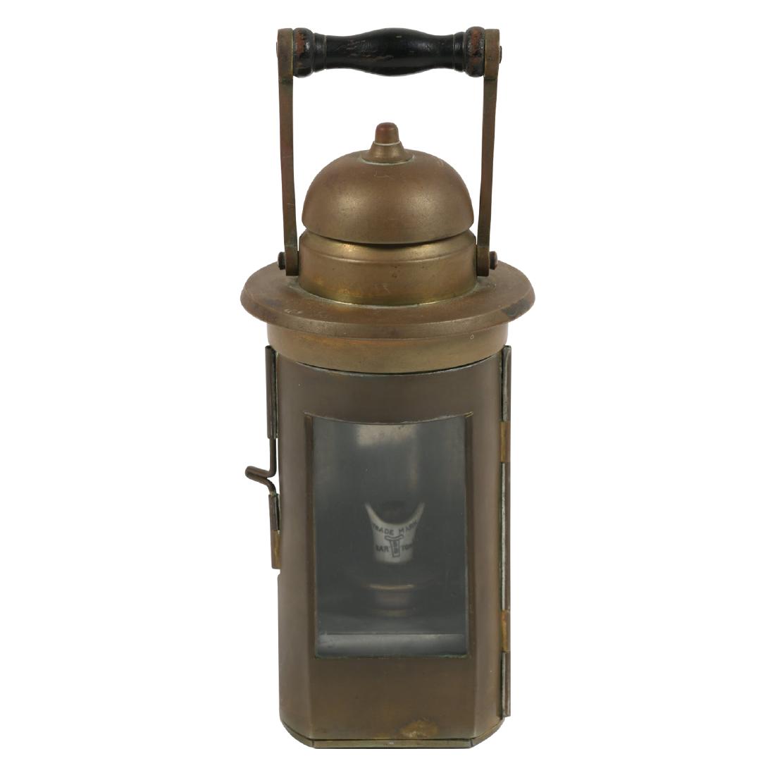 Brass Ship's Binnacle Lantern: English. Circa 1910. Used to view a ship's compass at night. Porcelain burner marked "Trade Mark - Barton's BB". 10" x 4". Untouched original condition. Complete. $200-300.