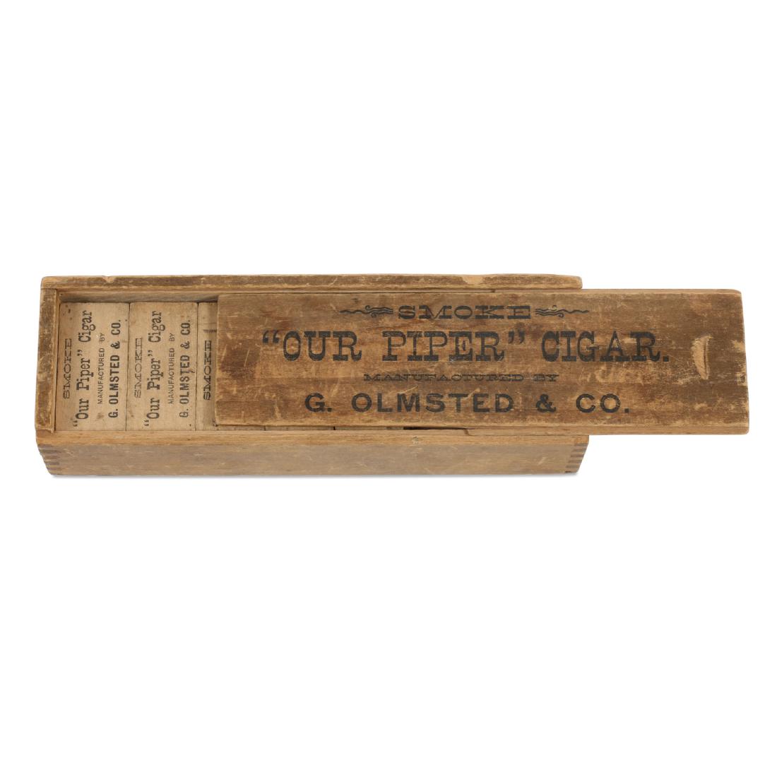 "Our Piper" Cigars Boxed Dominoes Set: Cigars manufactured by G. Olmstead & Co. Each domino printed with promotional text. 6.5" x 2" x 1.5". Upper edge missing from box. Includes 20 dominoes. $50-100.