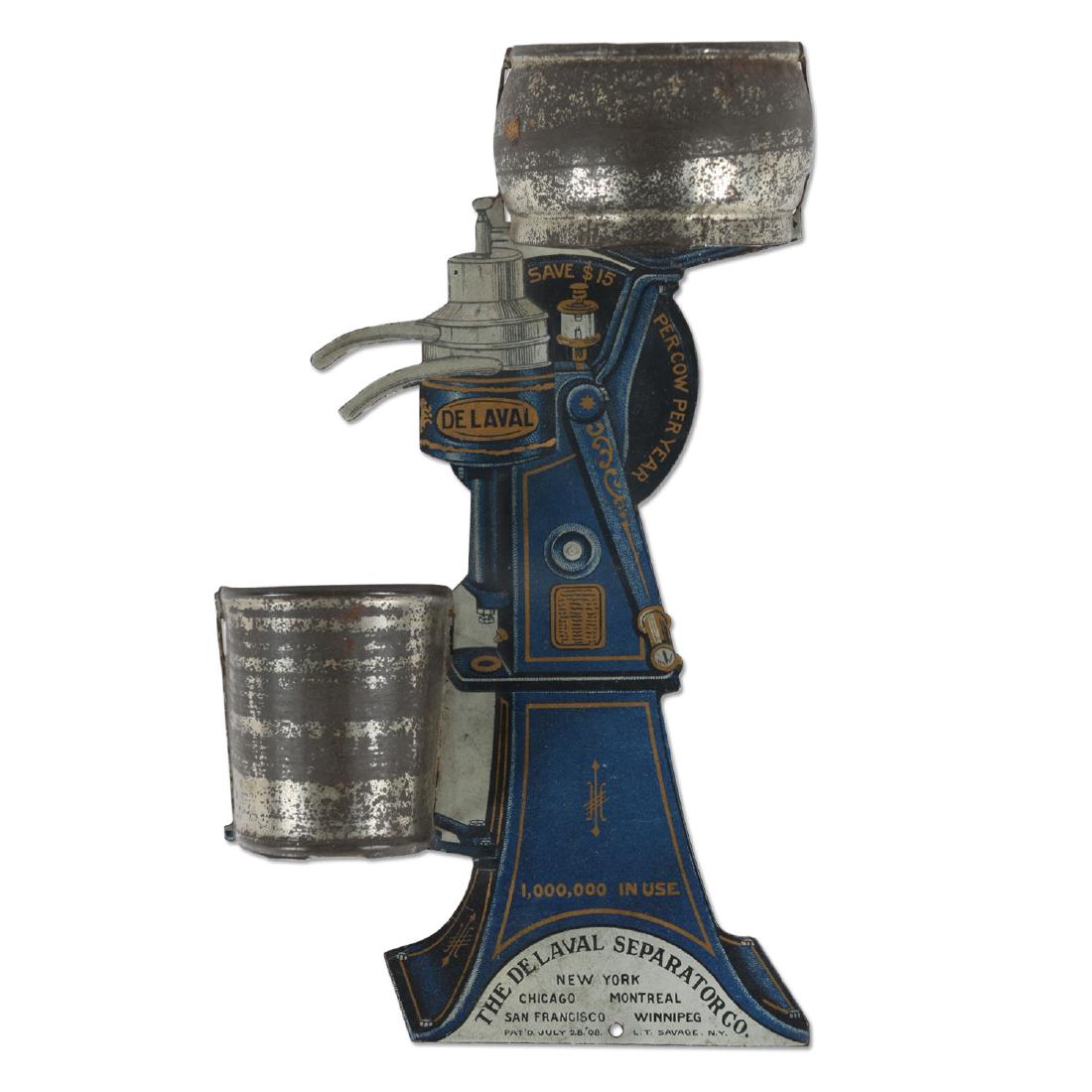 De Laval Tin Litho Match Safe: American. Circa 1908. Figural cream separator wall mounted match holder. Advertising premium. Marked, "Pat July 28 1908 LT Savage NY New York, Chicago...San Fran, Winnipeg". Shallow bend and minor sur