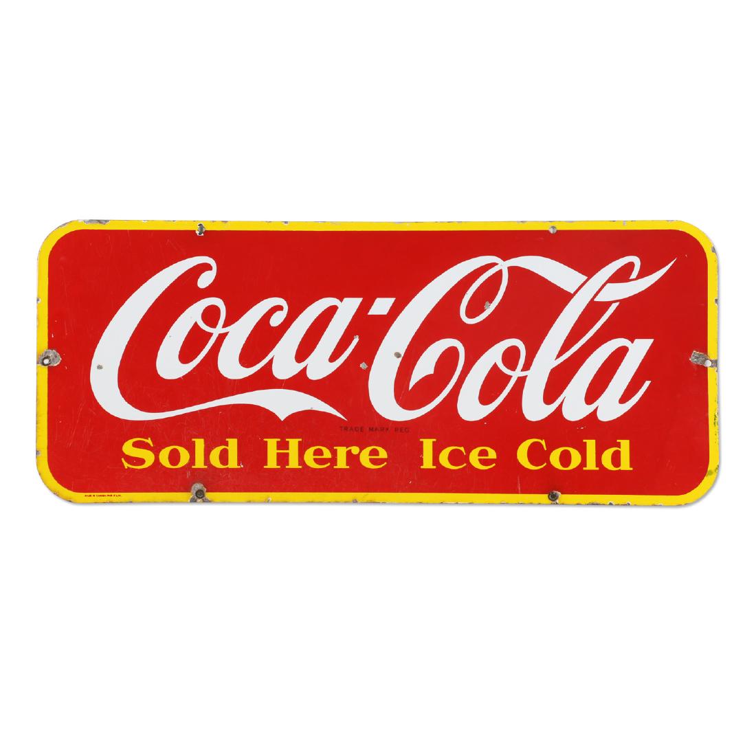 Coca-Cola Porcelain Door "Kick" Plate Sign: Canadian. Circa 1948. "Made in Canada 1948 P&M" lower left edge. 29.25" x 12". Scattered minor porcelain chips and surface scratches. Most wear isolated to the edges. $300-500.