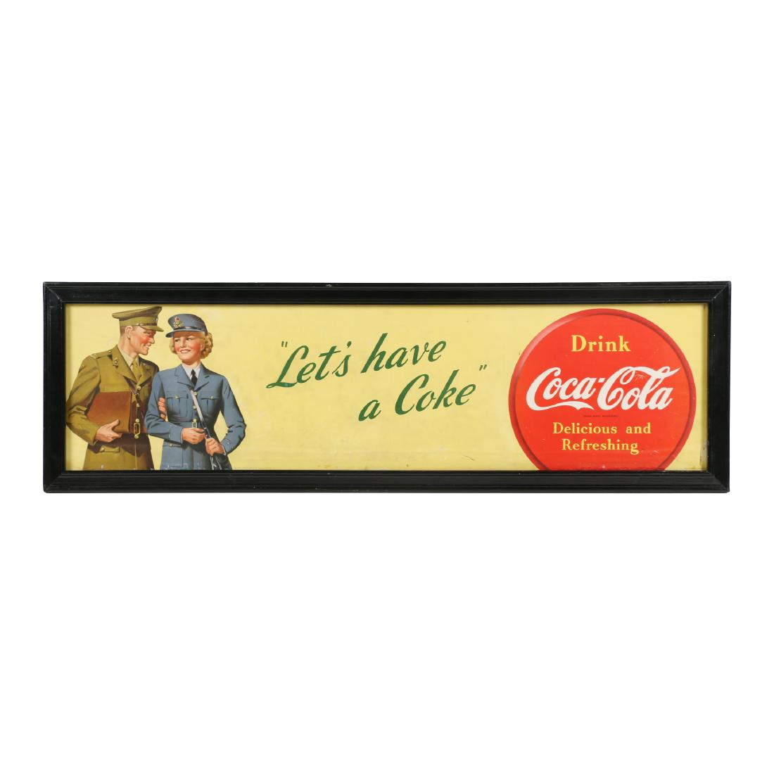 Coca-Cola Cardboard Trolley Sign: Canadian. Circa 1943 (WWII-era). Marked, "The Coca-Cola Company of Canada Ltd" lower edge. "Lithographed in Canada - 1943" lower right. Framed. 40.25" x 10.5". Minor soiling. Touch-up, lower right edg