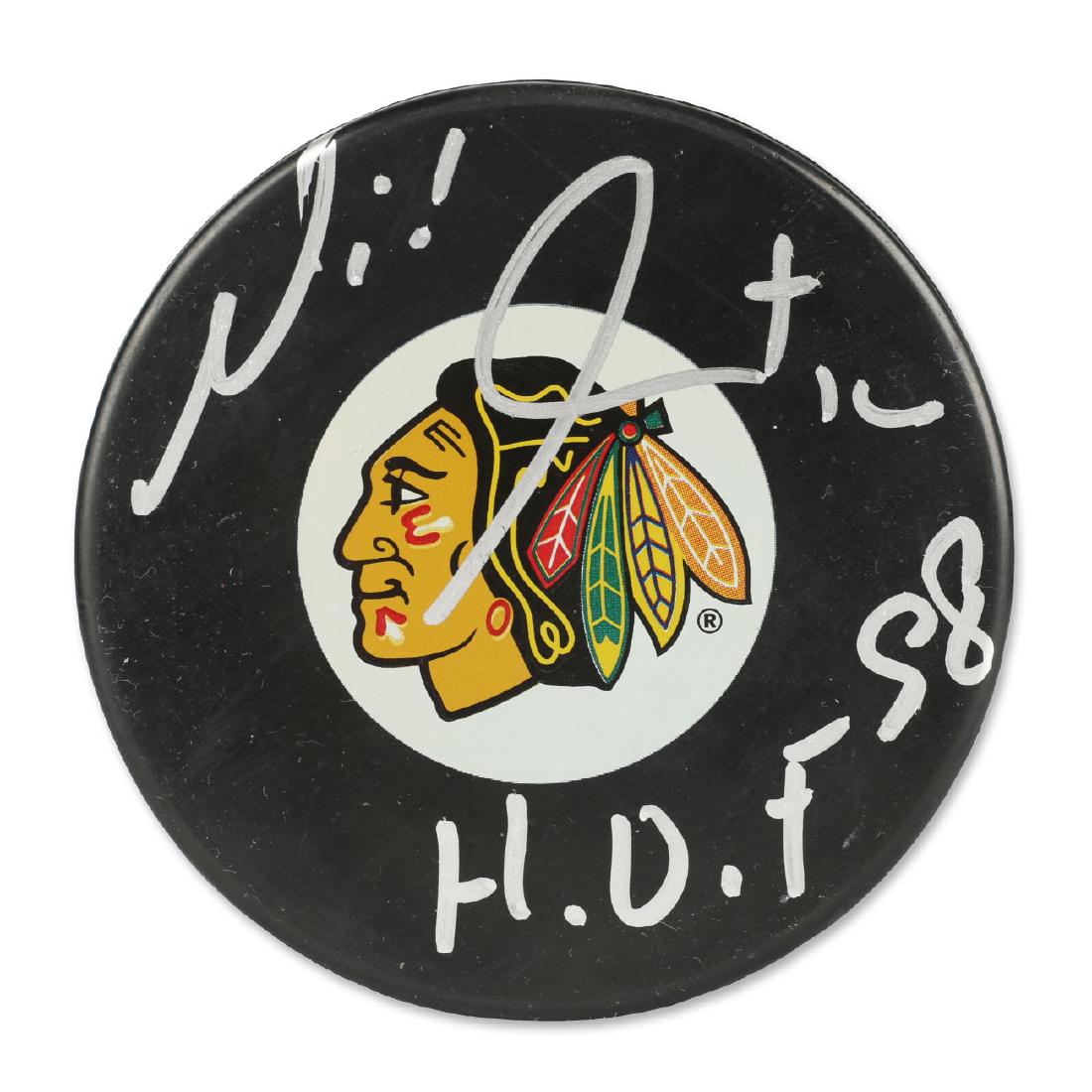 Signed Michel Goulet Hockey Puck: HHOF 98. Chicago Blackhawks .