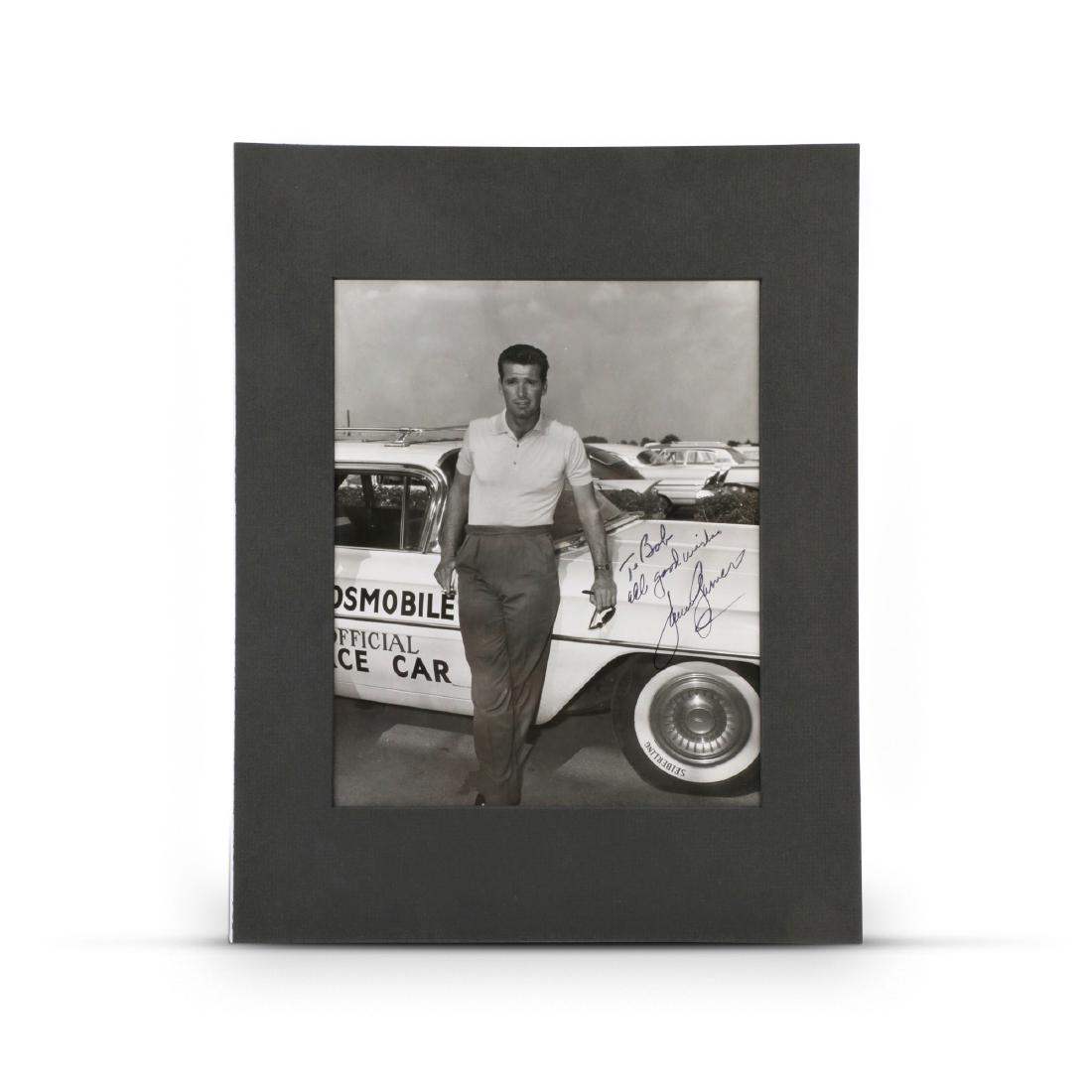 James Garner Autographed Indy 500 Photo: American. 1960. Signed, "To Bob all good wishes James Garner" Features 1960 Oldsmobile Pace Car. Sight: 8" x 10". Crisp original condition. John Martynuk Collection. 100-200
