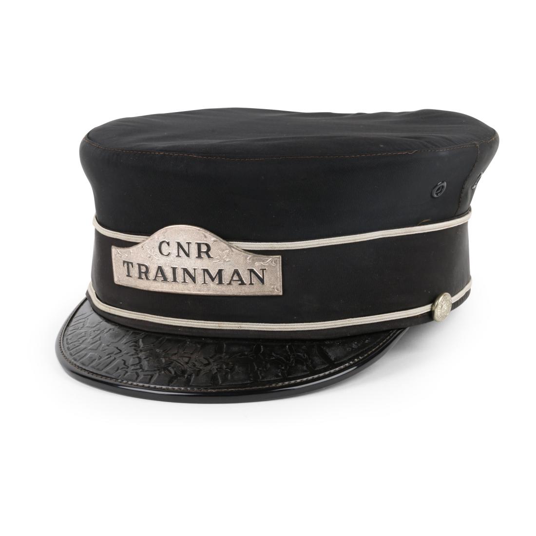 CNR Trainman Hat: Canadian. 1900s. Canadian National Railway. Pin marked, "WILLIAM SCULLY MONTREAL", "349249-2 E.T. CLARK". Size 7.5. Good. Minor stain, soil. Complete. 100-200