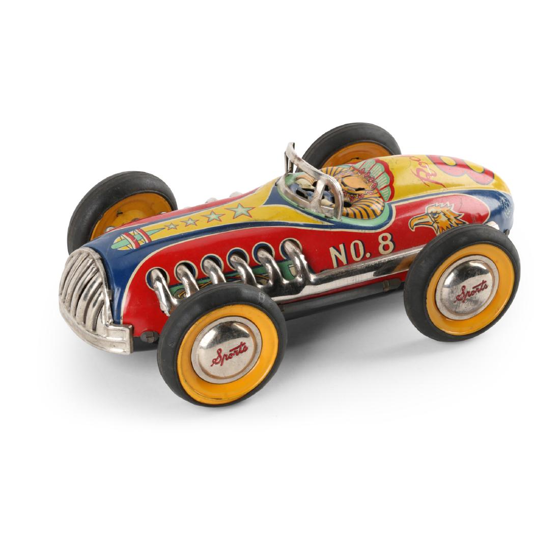 Yonezawa Japan Friction Sportscar: Japanese. 1950s. Friction functioning. Trade Mark Y for "Yonezawa" on back quarters. 11.5" x 7" x 4". Good. Lithographed tin driver bust missing. Vibrant colour lithography. Minor oxidization to chrom