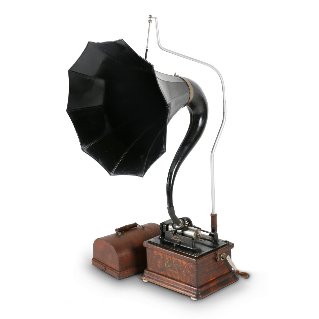 Edison "Fireside" Gramophone: American. 1910s. Marked, "Edison". 12" x 9" x 11". Horn 19" (dia.) x 19". Retains original crank and "Cygnet" horn (partial labels) suspended by reproduction crane. Worn finish. 900-1200