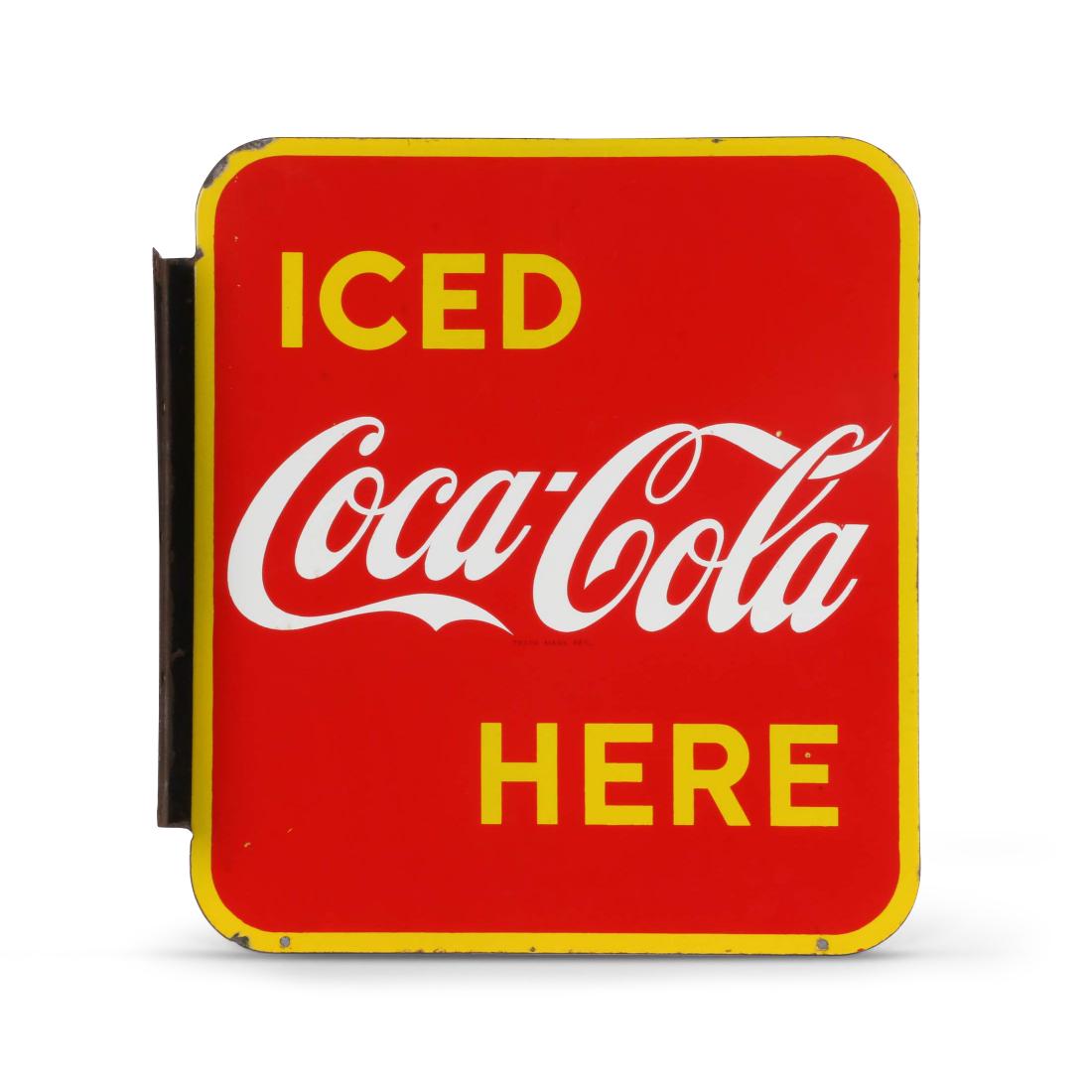 Coca-Cola Porcelain Flange Sign: Canadian. 1950s. "MADE IN CANADA P&M". 17.75" x 19". Very Good. Minor surface loss near flange and edges. Two pebble-sized losses to field. Brilliant colour and gloss. No restoration or touch-ups. 600