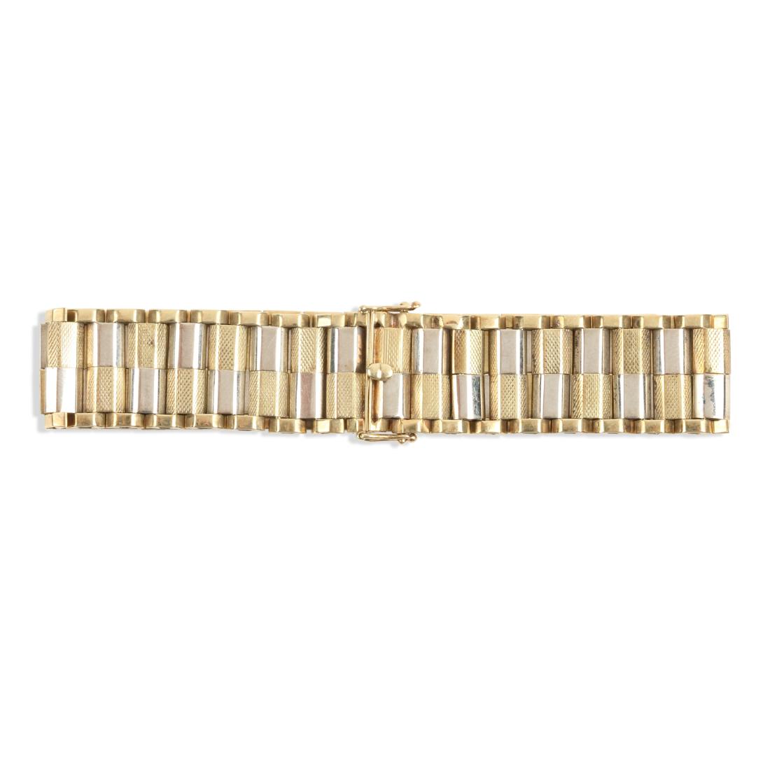 A 14K Yellow & White Gold Bracelet: QUANTITY: 1. MEASUREMENTS: 18cm. GROSS WEIGHT: 31.95g . NOTES: A few minor shallow impressions. Marked ".585". Est. $800-1000.