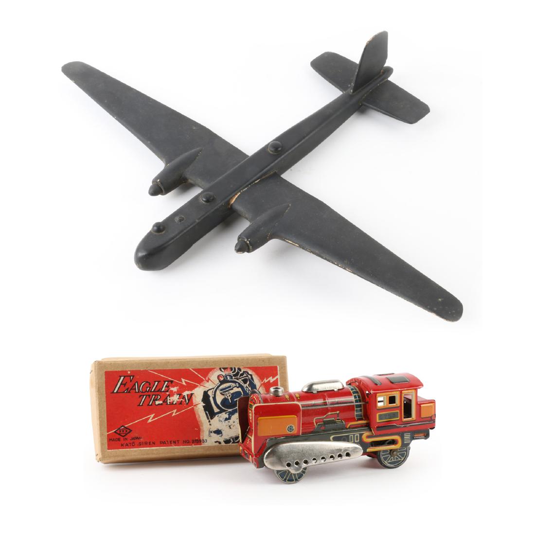 Train & Plane Toys: Two (2). "MADE IN JAPAN" and "STORES No52/412 Scale 1/72 HEINKEL HE.177". 5.5" x 2" x 2.5". Original graphic box. Toy functions. Excellent original lithographed surface. 25-50.