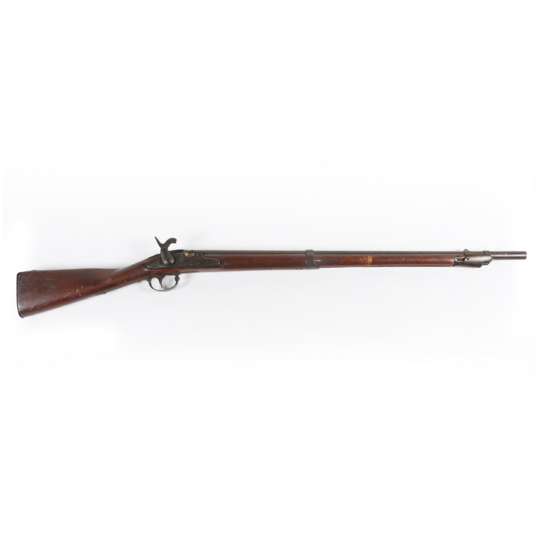 Harper's Ferry Rifle: 47.5" long. Converted to percussion. Gashes to stock with a piece of wood missing from upper stock. Firing pin removed. Est. $100-200