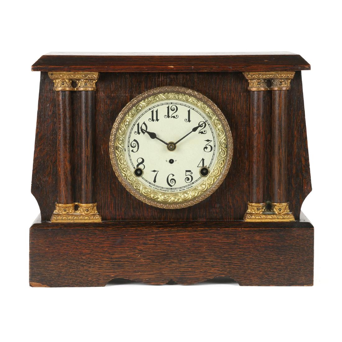 Pequegnat 1st Issue "Peterboro" Shelf Clock: The "Peterboro" model is found in two styles. This earlier first edition example features a curved-sided case. Movement & dial signed, "Pequegnat Clock Co. Berlin, Ont". Full long-format paper, caseba