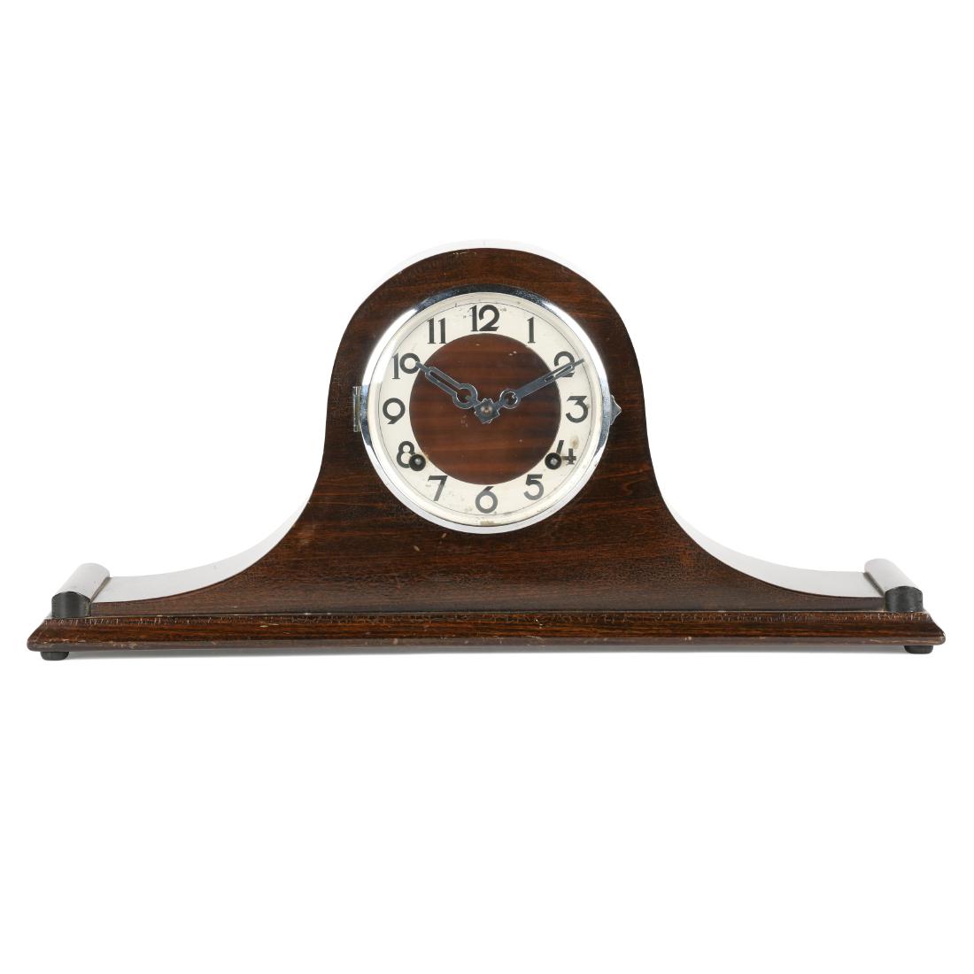 Pequegnat "Essex" Shelf Clock: This late model features a chrome bezel, art deco dial and chrome hands. Full paper label affixed to the rear interior door marked, "Essex Eight-Day Clock Made by The Arthur Pequegnat Clock Co. Kitche