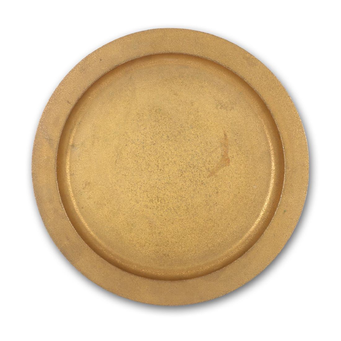 Tiffany Studios 12" Bronze Tray: American. Circular hammered bronze 12" serving tray. Stamped underneath on edge, "Tiffany Studios New York, 1721.". 12" x 12" x 0.5". Hammered bronze. Some stains and oxidation.