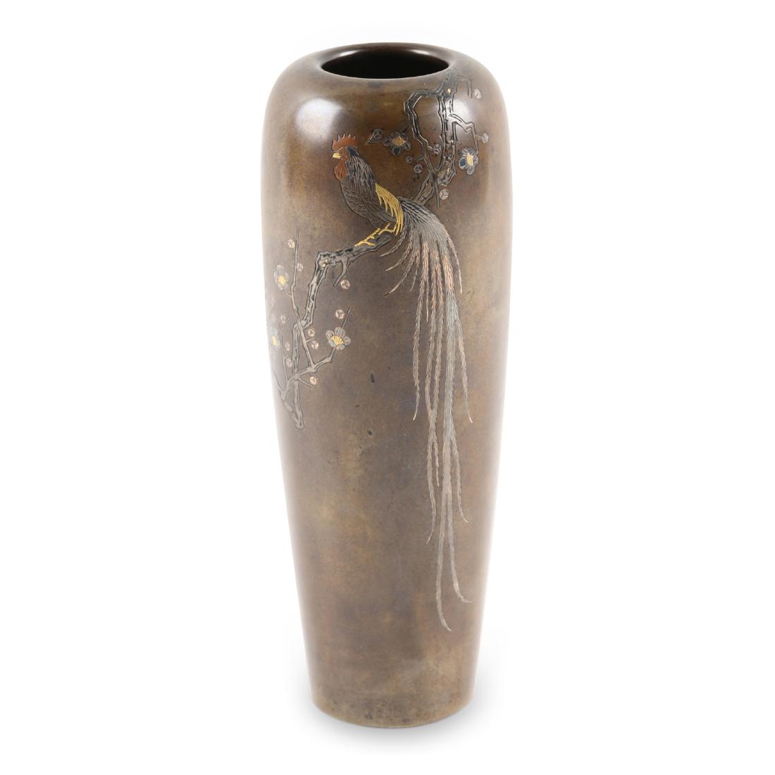 Japanese Meiji Bronze Mixed Metal Vase: Japanese. Meigi 1880-1890. Depicts a rooster on blossoming branches. Two characters, lower quarter, right side. 7.25" x 3" x 3". Shows patina.
