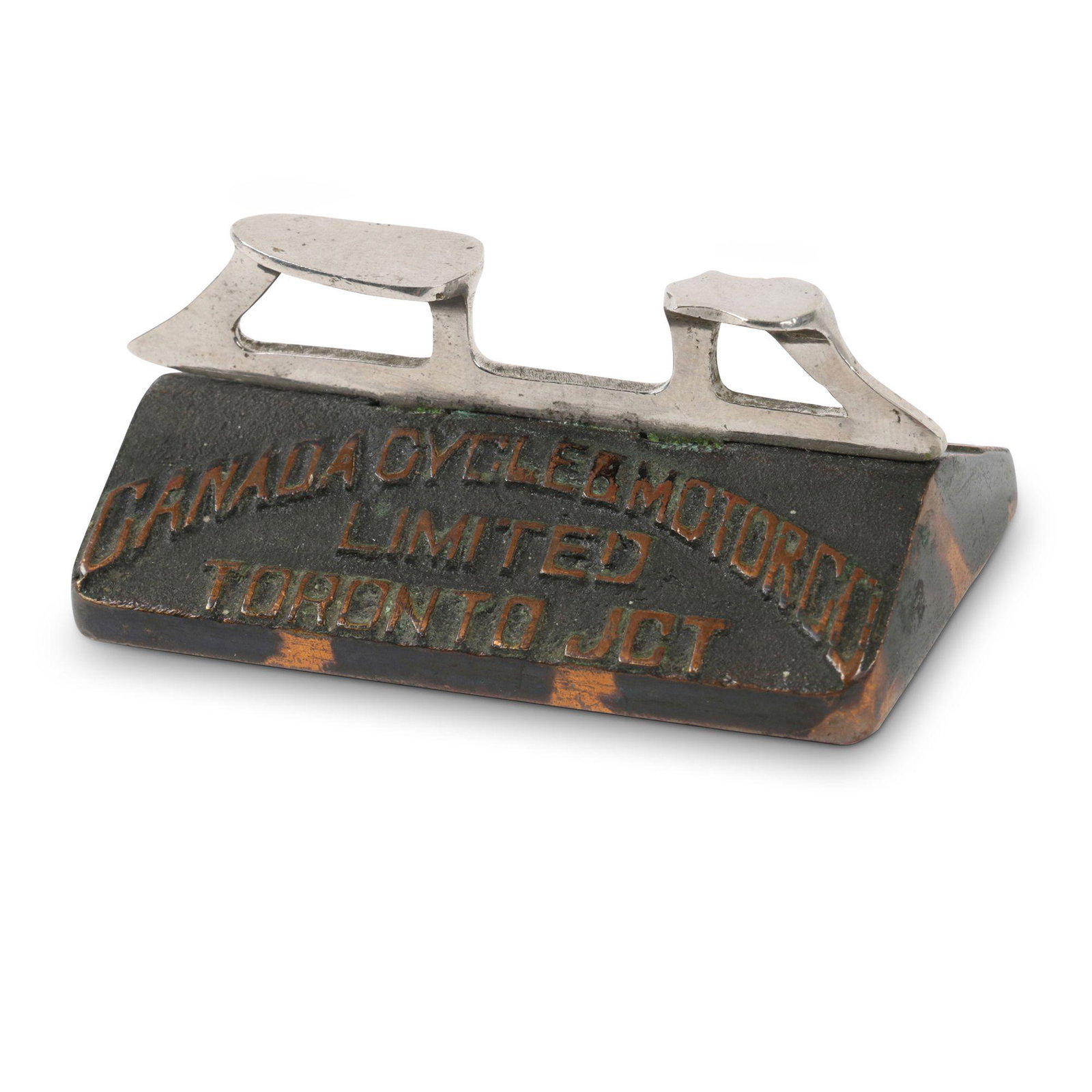 Canada Cycle & Motor Paperweight: Canadian. Cast copper. Features nickel plated skate mounted to cast copper base. Marked, "Canada Cycle & Motor Co Limited, Toronto Jct - Bicycles, Skates & Accessories". 3" x 1.75" x 1.25". Original, 