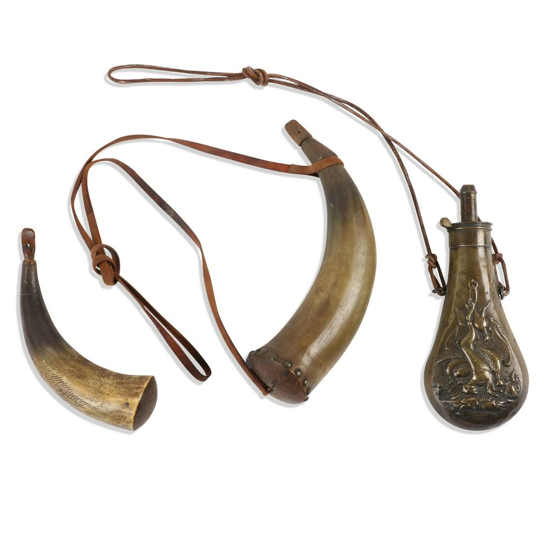 AM Flask Co. & Horn Powder Flasks: American Flask Company. American. One horn flask has interesting "notched" edge near tip. Embossed flask stamped near spout, "Am. Flask Co.". Embossed flask measures 8.25" (h). Largest horn measures 8