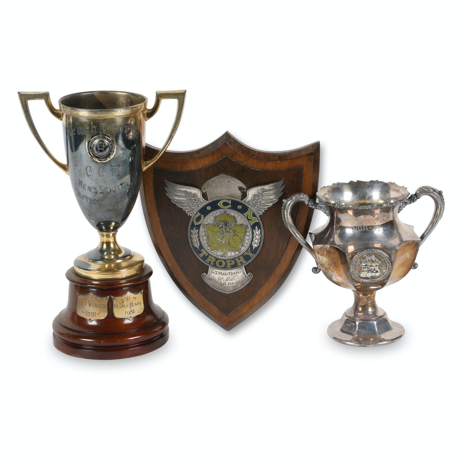 CCM Sporting Awards: Three (3). Canadian. Largest 10.5" x 6.75" x 4". "Reach" Trophy exhibits heavy loss to the gilt surface.