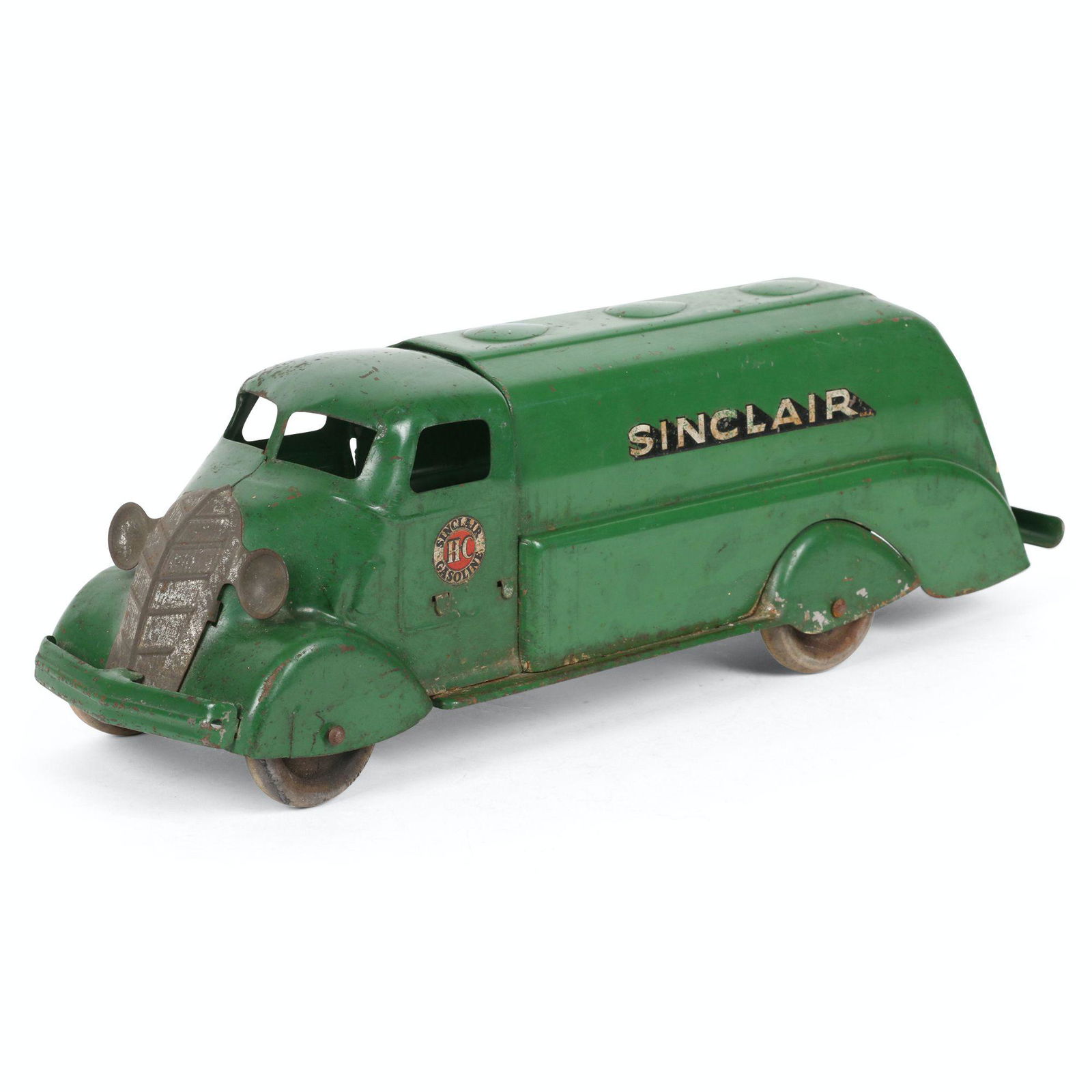 Sinclair Toy Oil Tanker: 18" x 5" x 5". American. Pressed Steel with wood wheels. Surface scuffs at edges. Decals with some uniform loss. Loss to silvered finish on grille.