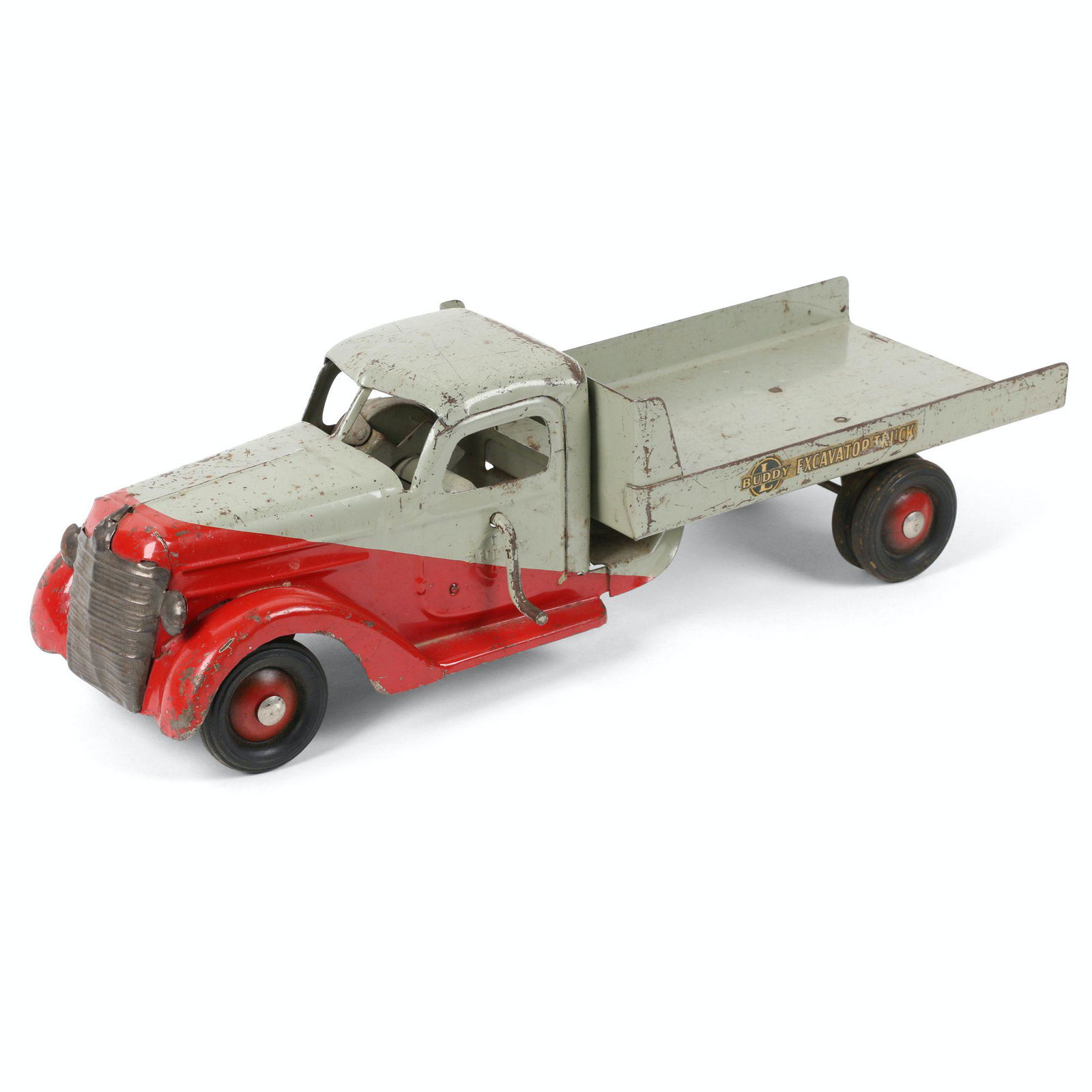 Buddy L Excavator Truck Toy: 28" x 7" x 6". American. Circa 1940s. Spring mechanism dysfunctional. Marked, "Mini Buddy L International 1938". Sunday Jan. 21, 1988, purchased at Mel's Antiques in Baden. Surface exhibits light to m